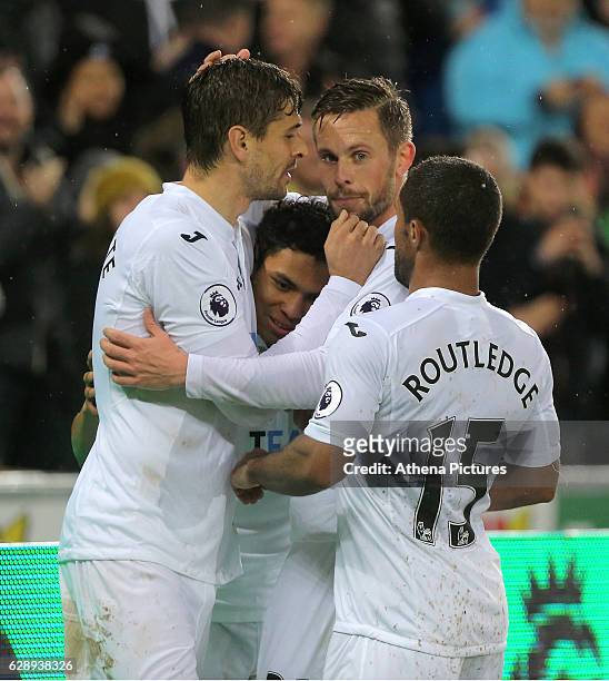 Fernando Llorente of Swansea City celebrates his second goal with Jefferson Montero, co-scorer Gylfi Sigurdsson and Wayne Routledge during the...