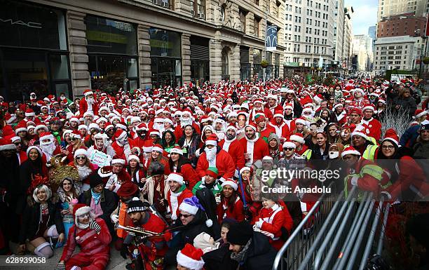 Revellers dressed up as Santa Claus take part in the annual Santacon festival at Times square in New York, United States on December 10, 2016....