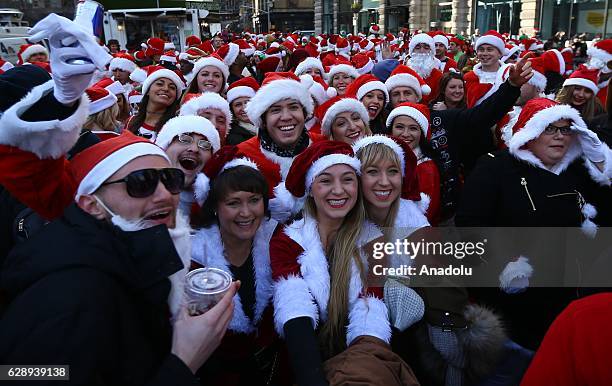 Revellers dressed up as Santa Claus take part in the annual Santacon festival at Times square in New York, United States on December 10, 2016....