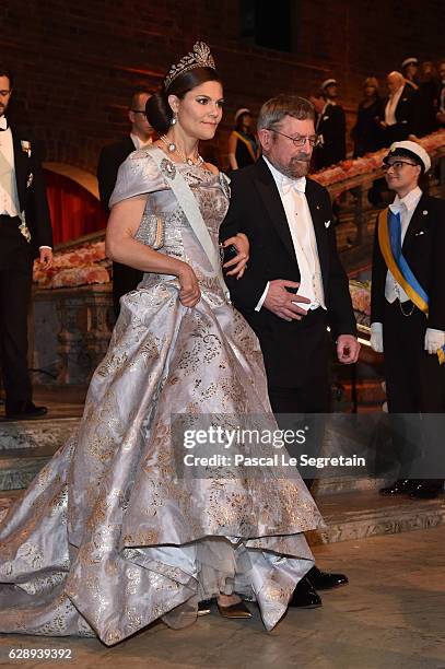 Crown Princess Victoria of Sweden and Professor J. Michael Kosterlitz, laureate of the Nobel Prize in Physics arrive at the Nobel Prize Banquet 2015...