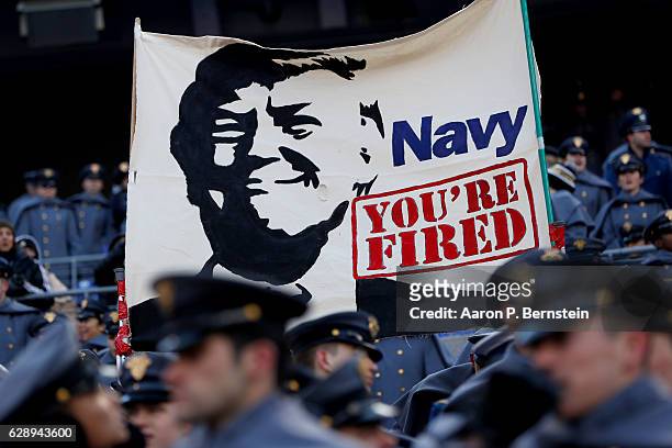 Cadets from the U.S. Military Academy fly a banner depicting President Elect Donald Trump prior to the game between the Navy Midshipmen and the Army...