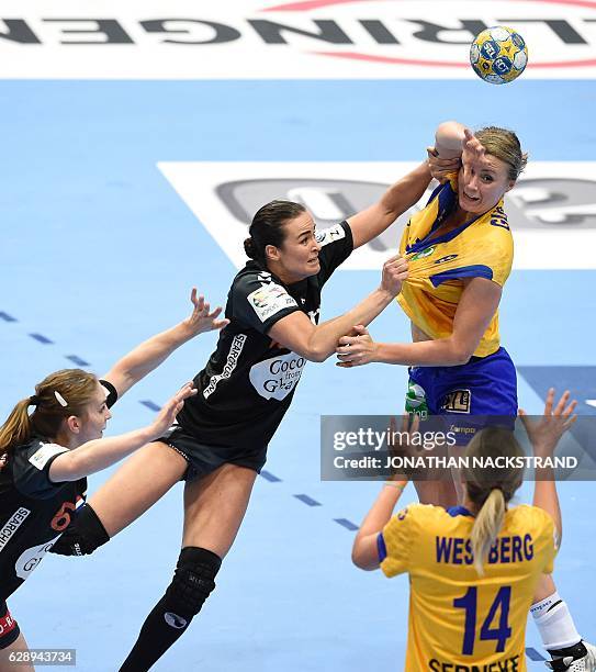 Sweden's Isabelle Gullden looks to pass the ball to her teammate Johanna Westberg during the Women's European Handball Championship Group I match...