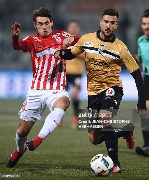 Nancy's French midfielder Vincent Marchetti vies for the ball with Angers' French defender Pablo Martinez during the French L1 football match between...