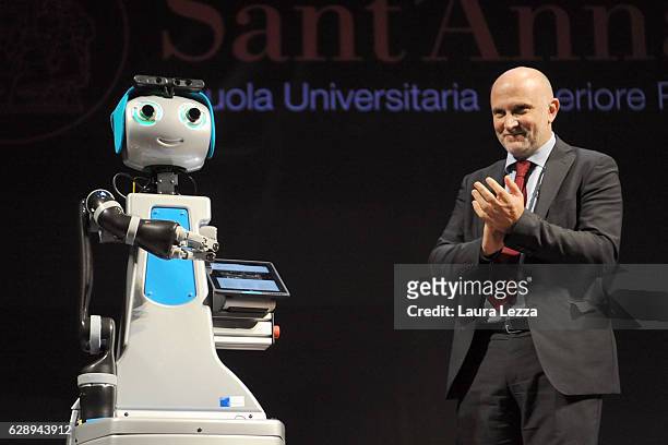 The robot Doro beside the Rector of Scuola Superiore Sant'Anna di Pisa Pierdomenico Perata, officially openes the Academic Year at Scuola Superiore...