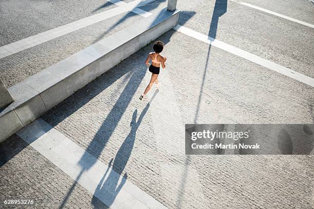 Shadow Running Back Woman Running Shadow Photos and Premium High Res Pictures - Getty Images