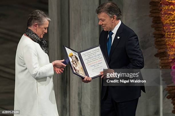Berit Reiss-Andersen of Norway, President Juan Manuel Santos of Colombia receives his Nobel Peace Prize Award during the Nobel Peace Prize ceremony...
