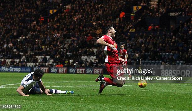 Blackburn Rovers' Ben Marshall is tackled by Preston North End's Greg Cunningham and is shown a yellow card by referee Kevin Friend after going down...