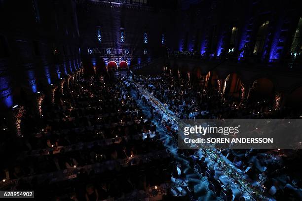The Table of Honour is surrounded by other tables during the 2016 Nobel Banquet for the laureates in medicine, chemistry, physics, literature and...