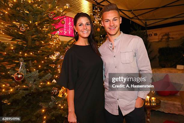 Joshua Kimmich of FC Bayern Muenchen attends with Lina Meyer the club's Christmas party at H'ugo's bar on December 10, 2016 in Munich, Germany.