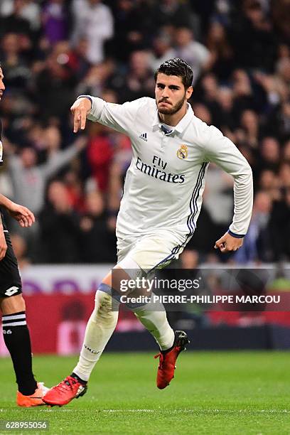 Real Madrid's forward Alvaro Morata celebrates after scoring during the Spanish league football match Real Madrid CF vs RC Deportivo at the Santiago...