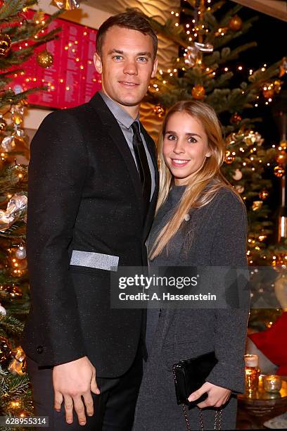 Manuel Neuer of FC Bayern Muenchen attends with Nina Weiss the club's Christmas party at H'ugo's bar on December 10, 2016 in Munich, Germany.