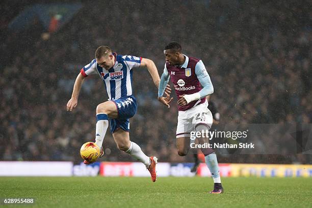 Jake Buxton of Wigan and Jonathan Kodjia of of Aston Villa Athletic in action during the Sky Bet Championship match between Aston Villa and Wigan...