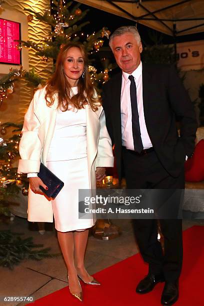 Carlo Ancelotti, head coach of FC Bayern Muenchen attends with Mariann Barrena McClay the club's Christmas party at H'ugo's bar on December 10, 2016...