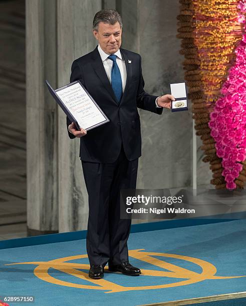 President Juan Manuel Santos of Colombia receives his Nobel Peace Prize Award during the Nobel Peace Prize ceremony at Oslo Town Hall on December 10,...