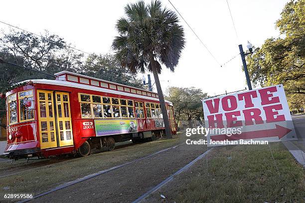 Streetcar passes a polling station on December 10, 2016 in New Orleans, Louisiana. Louisiana residents head to the polls on Saturday to select a U.S....
