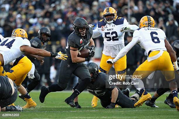 Andy Davidson of the Army Black Knights rushes the ball against the Navy Midshipmen in the first half at M&T Bank Stadium on December 10, 2016 in...