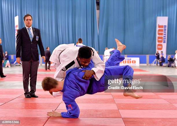Aaron Mahoney-Jones of Ernest Bevin JC thows Alan England of New Star JC for a wazari but eventually lost their u81kg contest by an ippon to Alan...