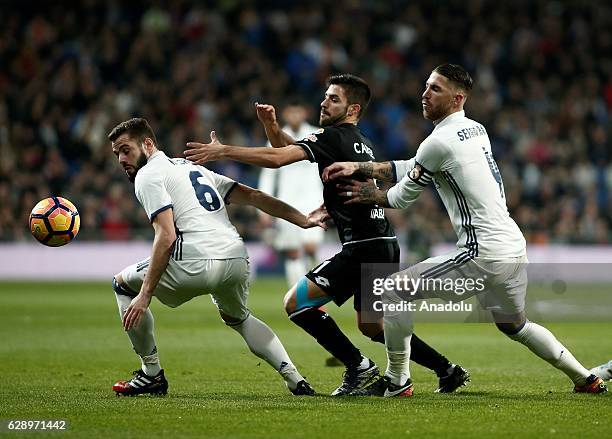 Carles Gil of Deportivo La Coruna in action against Nacho Fernandez of Real Madrid CF during the La Liga match between Real Madrid CF and RC...