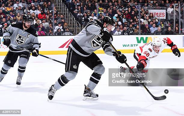 Tanner Pearson of the Los Angeles Kings battles for the puck against Mike Hoffman of the Ottawa Senators during the game on December 10, 2016 at...