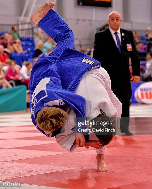 Neil MacDonald of JudoScotland throws Kieron Smythe of Grimsby JC for an ippon to win the u66kg gold medal in the Round 3 pool contest during the...