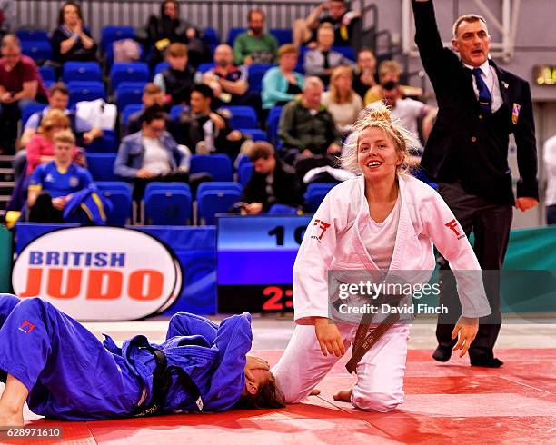 Kelly Petersen-Pollard of Hardy Spicer JC happily rises to her feet after holding Shelley Ludford of Osaka JC to win the gold medal and relegate...