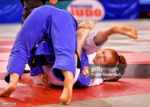 Lubjana Piovesana of Bishops Challoner JC chokes Lucy King of the Budokwai JC into submission with her triangular leg squeeze to eventually win the...