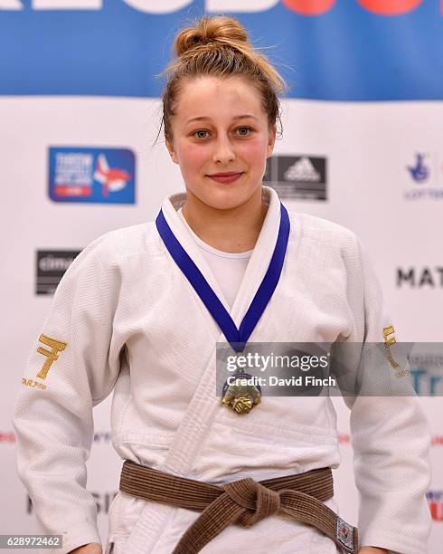 Sian Bobrowska of Hardy Spicer JC happily wears her u48kg gold medal during the 2016 British Junior Judo Championships at the English Institute of...