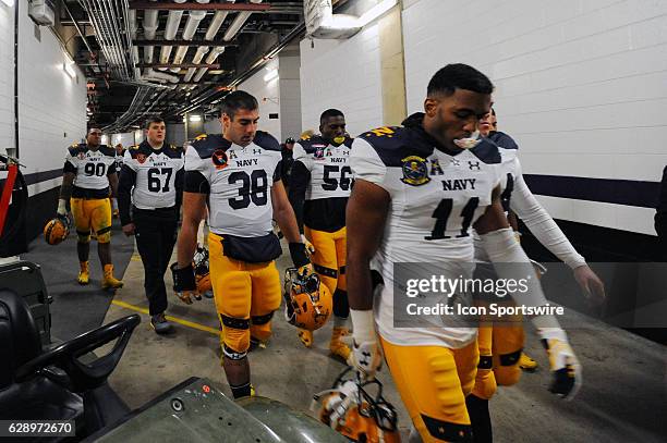 The Navy Midshipmen walk back to their locker room following the game against the Army Black Knights on December 10, 2016 at M&T Bank Stadium in...