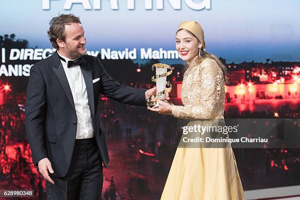 Jason Clarke gives the Best Actress prize to Fereshteh Hosseini during the closing ceremony of the 16th Marrakech International Film Festival : Day...