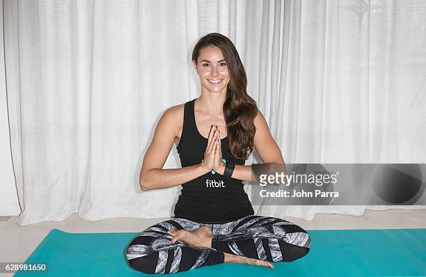 Fitbit Local Ambassadors Jennifer Pansa will lead participants in a yoga workout. During the Launch Of Fitbit Local Free Community Workouts In Miami...