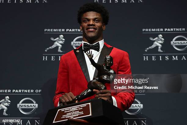 Lamar Jackson of the Louisville Cardinals poses for a photo after being named the 82nd Heisman Memorial Trophy Award winner during the 2016 Heisman...