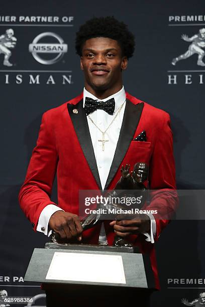 Lamar Jackson of the Louisville Cardinals poses for a photo after being named the 82nd Heisman Memorial Trophy Award winner during the 2016 Heisman...