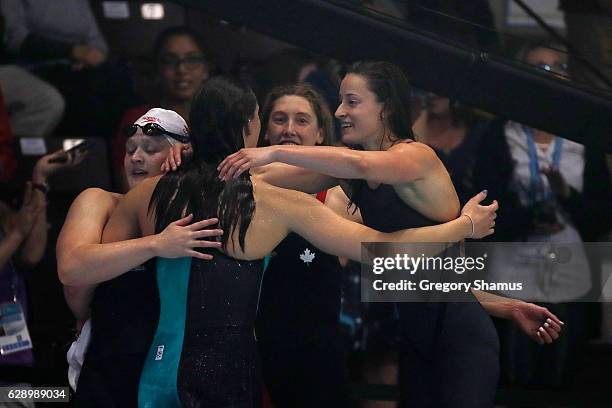 Team Canada celebrates their victory in the 4x200m Freestyle on day five of the 13th FINA World Swimming Championships at the WFCU Centre on December...