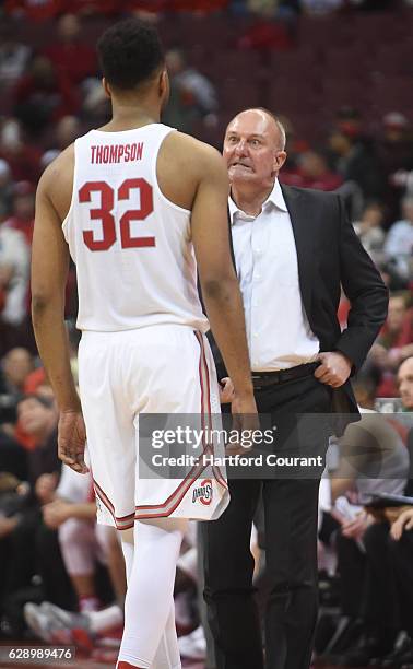 Ohio State head coach Thad Matta, right, speaks with Buckeyes center Trevor Thompson during action against Connecticut at Value City Arena in...