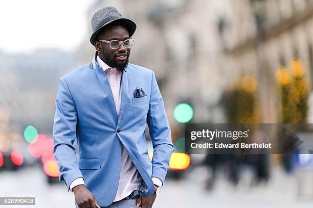 Sidya Sarr, fashion and life style blogger @theparisian, is wearing a Zara blue jacket, a Zara hat, an Andreas Osten watch, Nike Cortez blue shoes,...