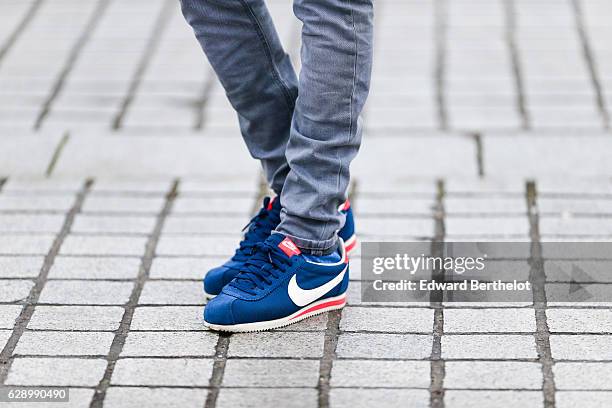 Sidya Sarr, fashion and life style blogger @theparisian, is wearing a Zara blue jacket, a Zara hat, an Andreas Osten watch, Nike Cortez blue shoes,...