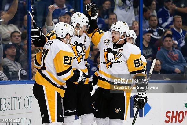 Pittsburgh Penguins center Evgeni Malkin celebrates with Pittsburgh Penguins right wing Phil Kessel , Pittsburgh Penguins center Sidney Crosby and...