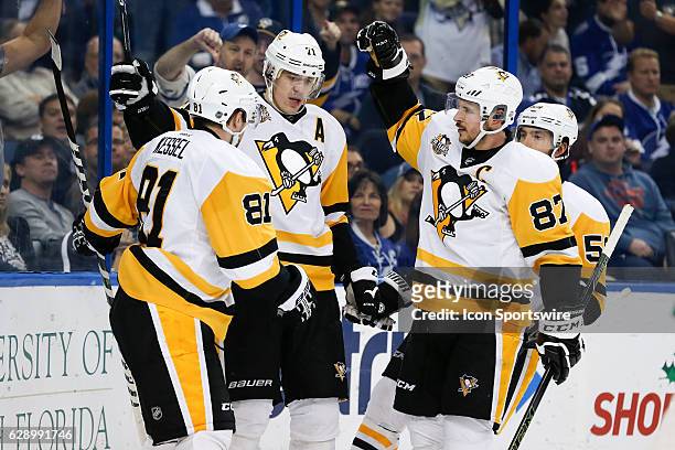 Pittsburgh Penguins center Evgeni Malkin celebrates with Pittsburgh Penguins right wing Phil Kessel , Pittsburgh Penguins center Sidney Crosby and...