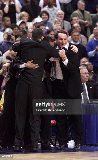 Mike Krzyzewski and the rest of the Duke coaches celebrate after defeating Arizona 82-72 in the NCAA National Championship Game of the Men's Final...
