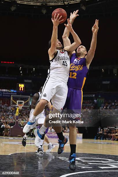 Chris Goulding of United lays up a shot under pressure from Aleks Maric of the Kings during the round 10 NBL match between the Sydney Kings and...