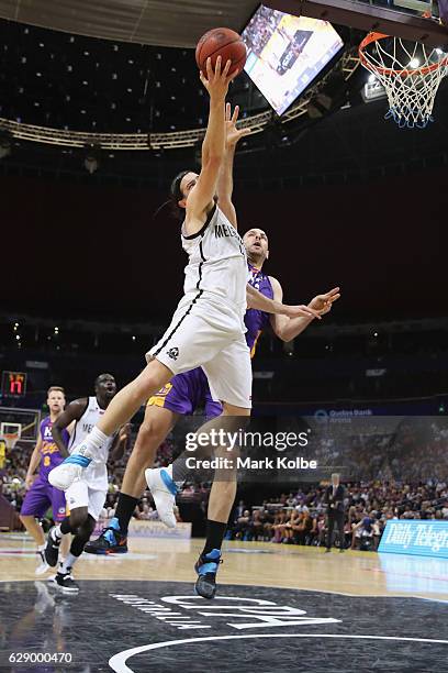 Chris Goulding of United lays up a shot under pressure from Aleks Maric of the Kings during the round 10 NBL match between the Sydney Kings and...