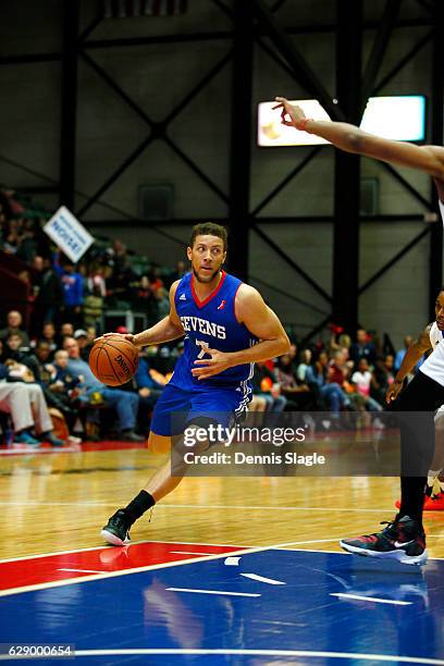 Brandon Triche of the Delaware 87ers handles the ball against the Grand Rapids Drive at The DeltaPlex Arena on December 10, 2016 in Grand Rapids,...