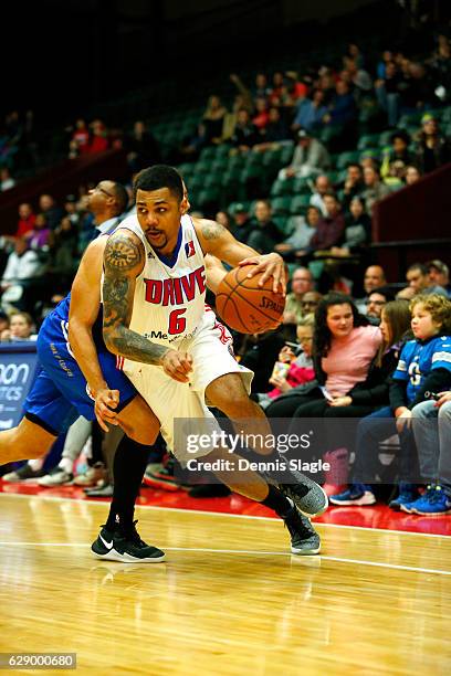 Michael Gbinije of the Grand Rapids Drive handles the ball against the Delaware 87ers at The DeltaPlex Arena on December 10, 2016 in Grand Rapids,...