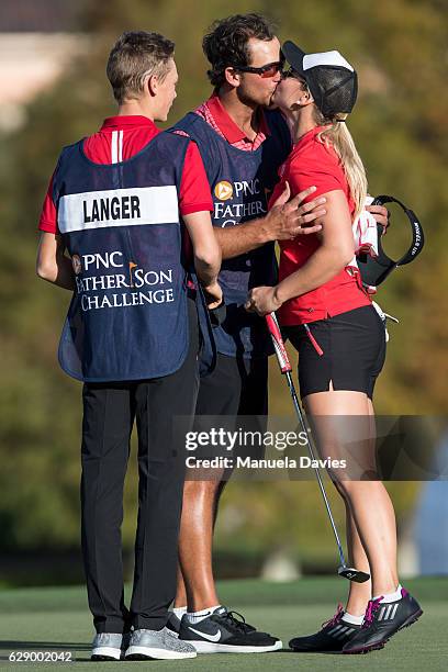 Christina Langer of Germany gets a kiss from caddy and fiance Chase De Jong on the 18th green after the first round of the PNC Father/Son Challenge...