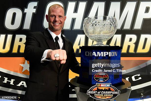 Whelen Southern Modified Tour Champion Burt Meyers poses for a portrait after the NASCAR Touring Series Night of Champions in the Charlotte...