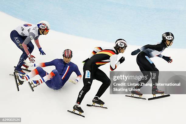 Paul Beauchamp of France fall after crash with Kei Saito of Japan, Da Woon Sin of Korea and Felix Spiegl of Germany competes in the men's 500m...