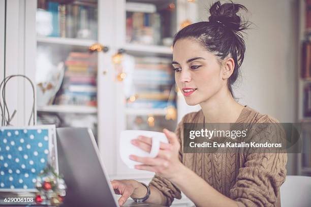 young woman at home - christmas coffee stock pictures, royalty-free photos & images