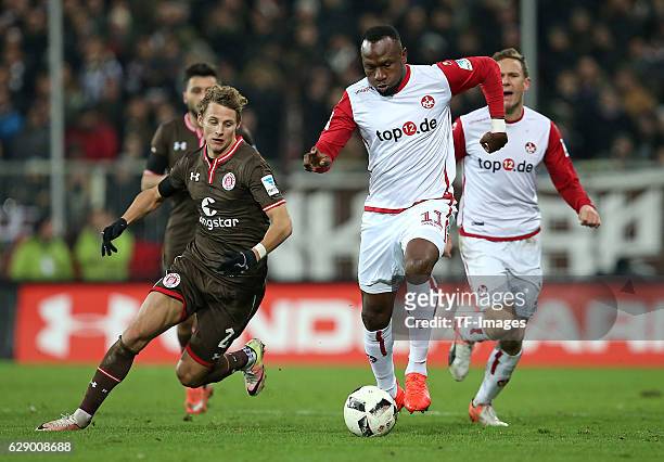 Vegar Eggen Hedenstad of St.Pauli and Jacques Zoua of Kaiserslautern battle for the ball during the Second Bundesliga match between FC St. Pauli and...