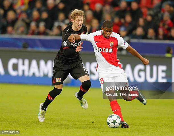 Stefan Kiessling of Leverkusen and Almamy Toure of Monaco battle for the ball during the UEFA Champions League match between Bayer Leverkusen and AS...