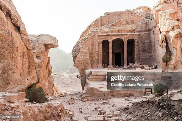 view of ancient archiological sites in petra - bedouin stock-fotos und bilder